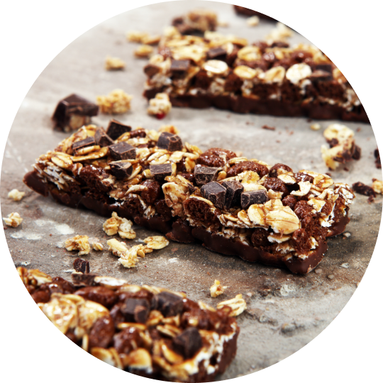 A close-up of freshly baked protein bars on a baking sheet.
