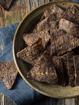 A bowl of homemade blue tortilla chips 